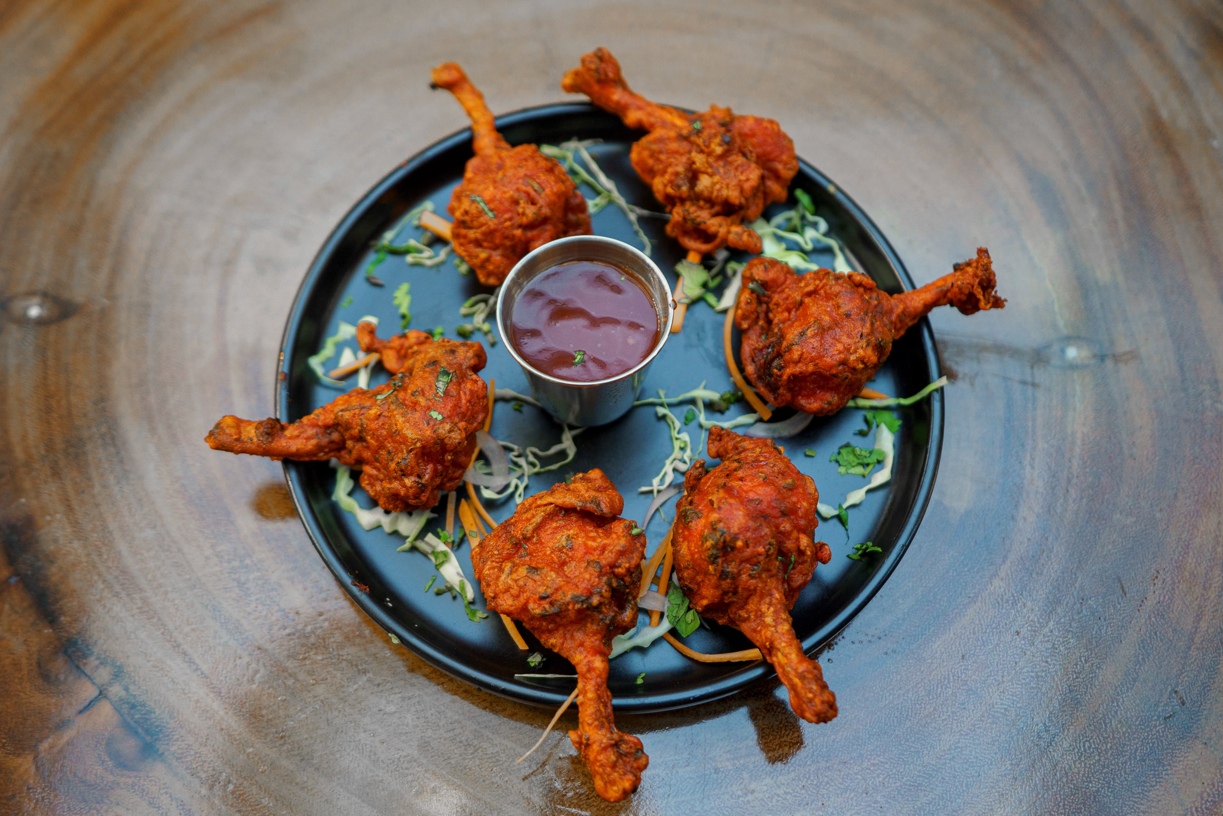 Chicken lollipops served with dipping sauce
